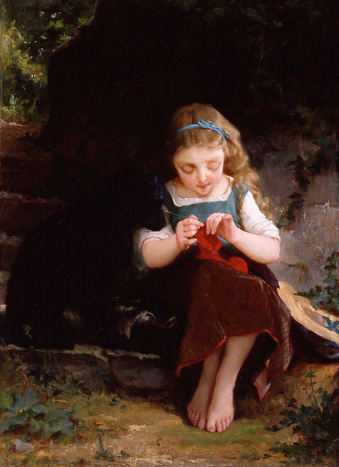 a young girl knitting with a dog by her side