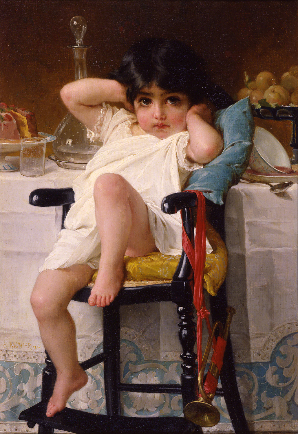 A young girl in a chair at a table
