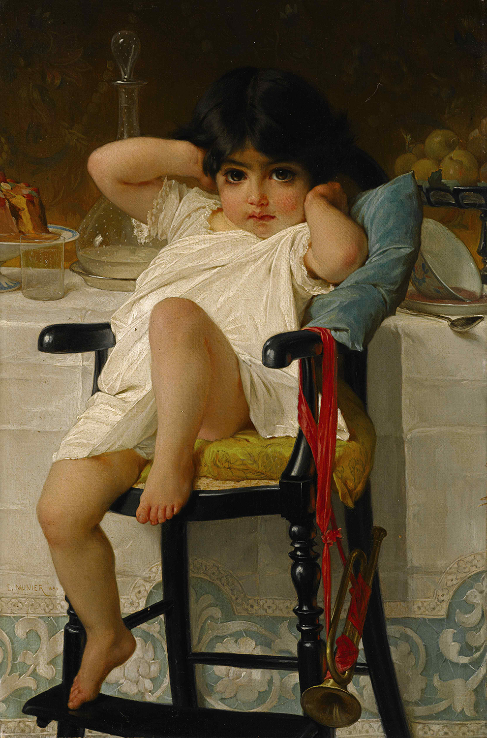 A young girl in a chair by a table