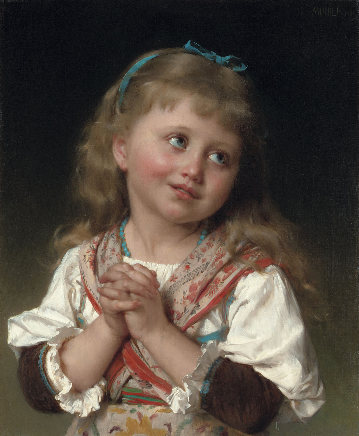 A youjng girl with her hands folded