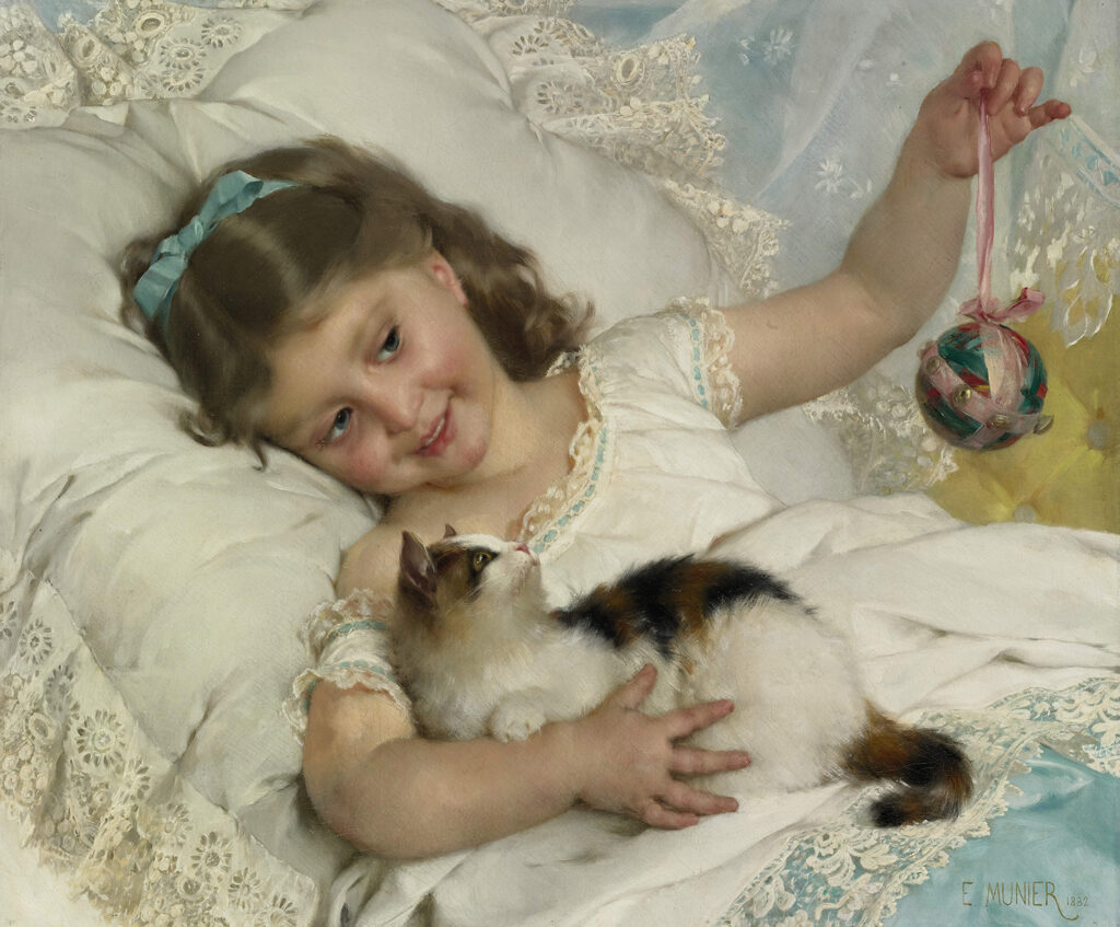 Young girl in bed with a cat